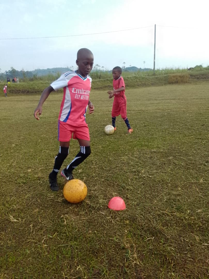 Youth football players together in training