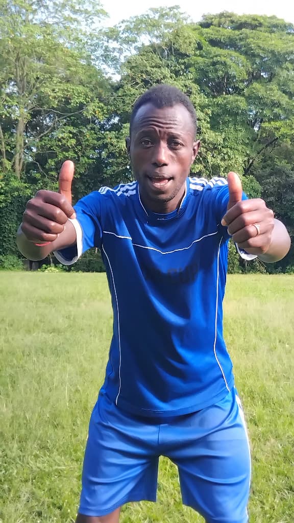 Youth football player on field representing discipline and focus
